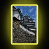 Himeji Castle walkway with neon sign at sunset