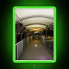 A futuristic walkway illuminated by vibrant RGB neon lights in a green hue.