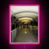 Neon pink walkway illuminated with RGB lights.