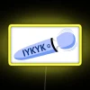Neon sign with colorful wavy lines forming a wand design.