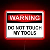 Warning neon sign with bold red letters reading 'Do Not Touch My Tools'