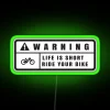 Neon warning sign with green glow.