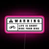 Neon warning sign with pink lights and bold lettering.
