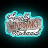 Neon warning sign with bold, blue letters reading 'Socially Awkward'