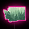 Neon sign with pink lights against a Washington state background