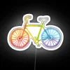 Neon bicycle under a colorful rainbow watercolor effect.