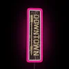 Neon sign in downtown area with pink color scheme at night.