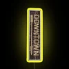 Neon sign with yellow lights on a city street at night