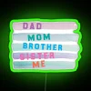 Neon sign reading 'We are a family' with colorful, glowing letters in RGB format.