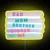 Neon sign reading 'We Are a Family' in colorful RGB letters, shining bright.