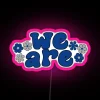 Neon sign with pink background featuring RGB logo in bold, futuristic font.