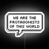 Neon sign with bold, colorful letters proclaiming we are the protagonists of our own world.