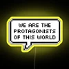 Neon sign with bold, colorful letters reading 'We Are The Protagonists Of This World'