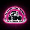 Colorful neon artwork with bold letters stating 'We Support Our Farmers'