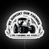 Neon sign artwork in support of farmers with colorful RGB lighting, promoting agricultural community and local farming.