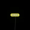 Neon welcome sign with black print in RGB color scheme, featuring a knit-themed design.