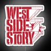 Neon sign of West Side Story logo in vibrant RGB colors, lit up at night.