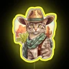 Western-themed cat wearing a hat in front of a colorful cactus under an RGB neon sign.