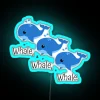 Neon whale sign in vibrant blue colors.