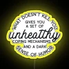 Neon sign with colorful lights spelling out 'What Doesn't Kill You'