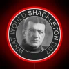 Neon sign with bold, colorful letters spelling out 'What Would Shackleton Do'