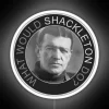 Neon sign with Shackleton's face, set against a dark background, inspired by Antarctic exploration.