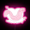 Neon sign of an eel biting someone's knee in the sea, depicted in a vibrant pink color.