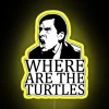 Turtle location sign in neon colors at Dunder Mifflin