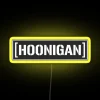 Neon sign with white and yellow colors against a dark background.