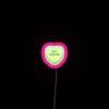 Neon sign with RGB color palette, highlighting Trope Heart branding.