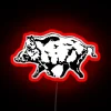 Neon sign featuring a stylized, colorful illustration of a wild boar.