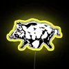 Wild boars in neon-lit surroundings, illuminated by vibrant yellow colors.