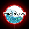 Neon sign featuring vibrant, colorful waves with red accents.