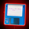 Windows 98 startup disk with neon sign in the background.