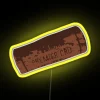 A close-up of a wine cork with neon colors and a yellow background.