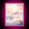 A serene winter wonderland scene with snow-covered mountains under a pastel pink neon glow.