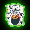 Witch's cauldron with neon green brewing potion on a Halloween-themed sign