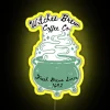 Neon sign with yellow glow, reading "Witches Brew Coffee" in bold letters.