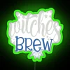 Neon sign with colorful, glowing letters spelling out 'Witches Brew'