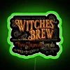 Neon sign featuring a colorful, glowing cauldron and mystical design
