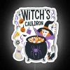 Witches' cauldron with vibrant, neon-lit steam in a colorful sign