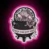 Witch-themed neon sign with a pink cauldron