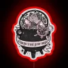 Witch's neon cauldron sign in vibrant red colors.