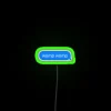 Neon sign with green letters displaying 'WOMP WOMP'