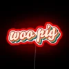 Retro-style neon sign featuring a smiling pig with bold red color scheme.