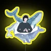 Neon sign of a whale with colorful neon lights.