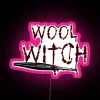 Neon pink sign featuring witchcraft-inspired wool knots in bright RGB colors.