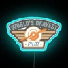 A neon sign reading 'World's Okayest Pilot' in blue LED lights.