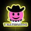 Neon yellow sign with stylized letters reading 'Y'all Alternative' in bold, colorful font.