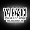 Neon sign with colorful, distressed RGB letters spelling out 'Basic'